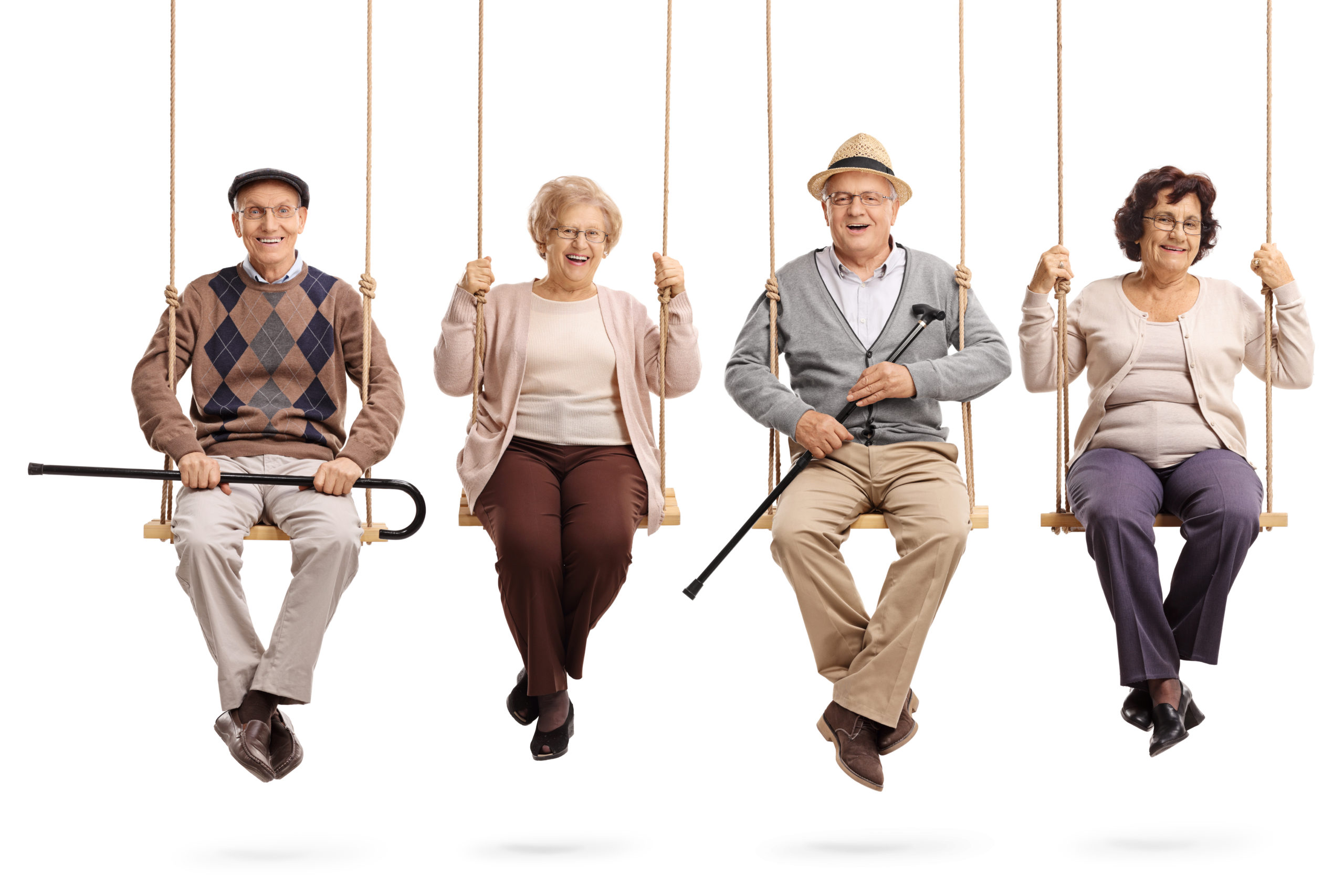 Seniors smiling on a swing