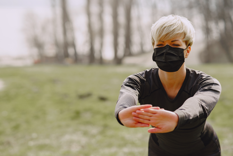 Woman exercising with mask