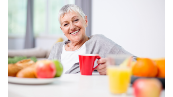 Smiling Healthy Senior with Colorful Fruit