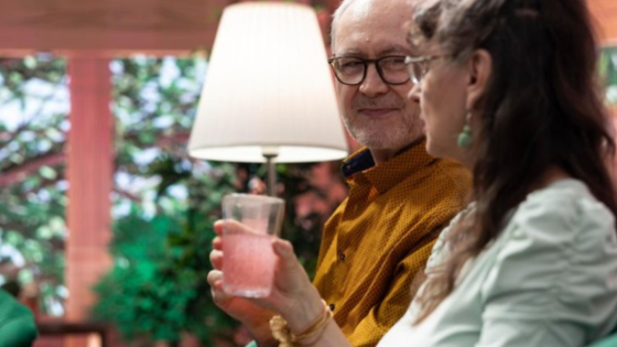 Older couple enjoying a conversation in a comfortable home setting while planning for a new chapter in life.